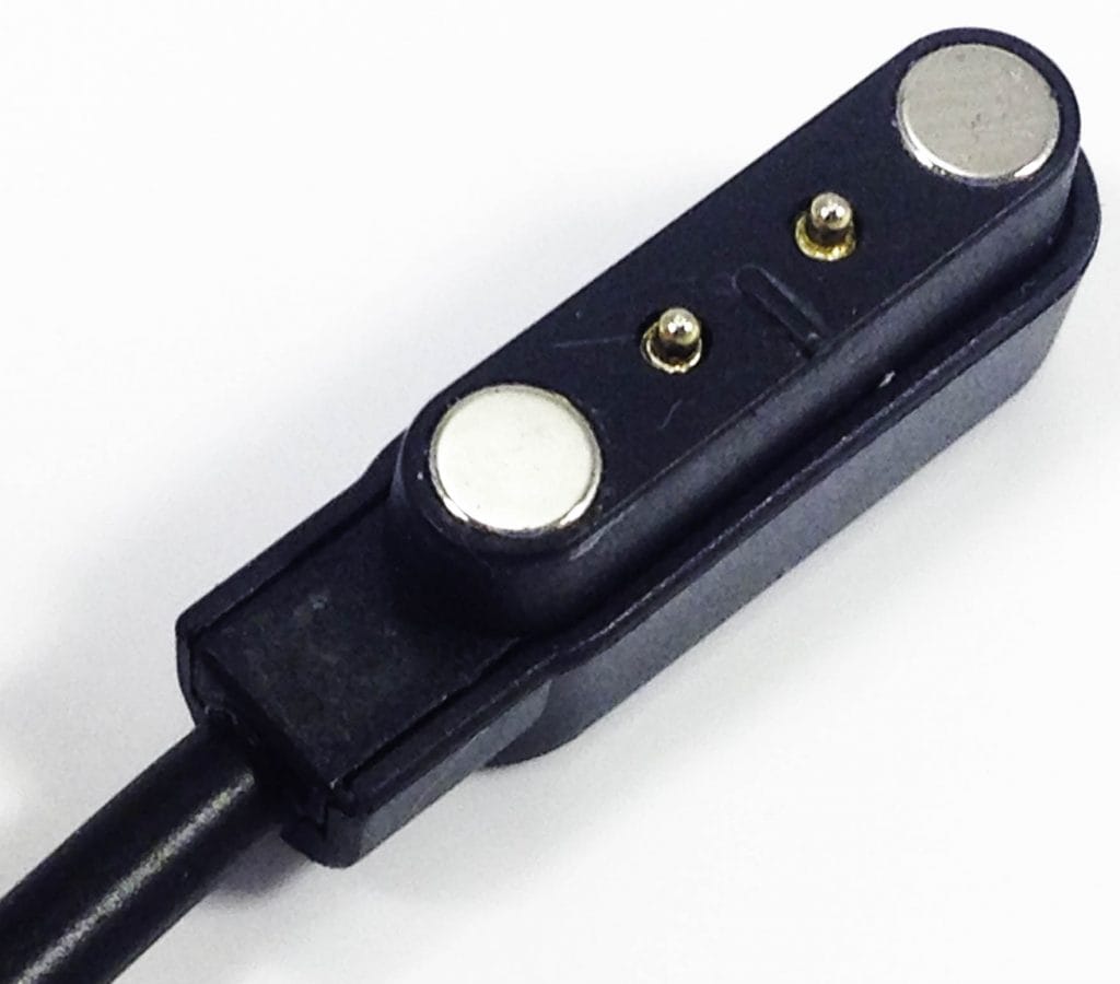 Image shows the charger port to the Torus Pro N69 Fitness Tracker.