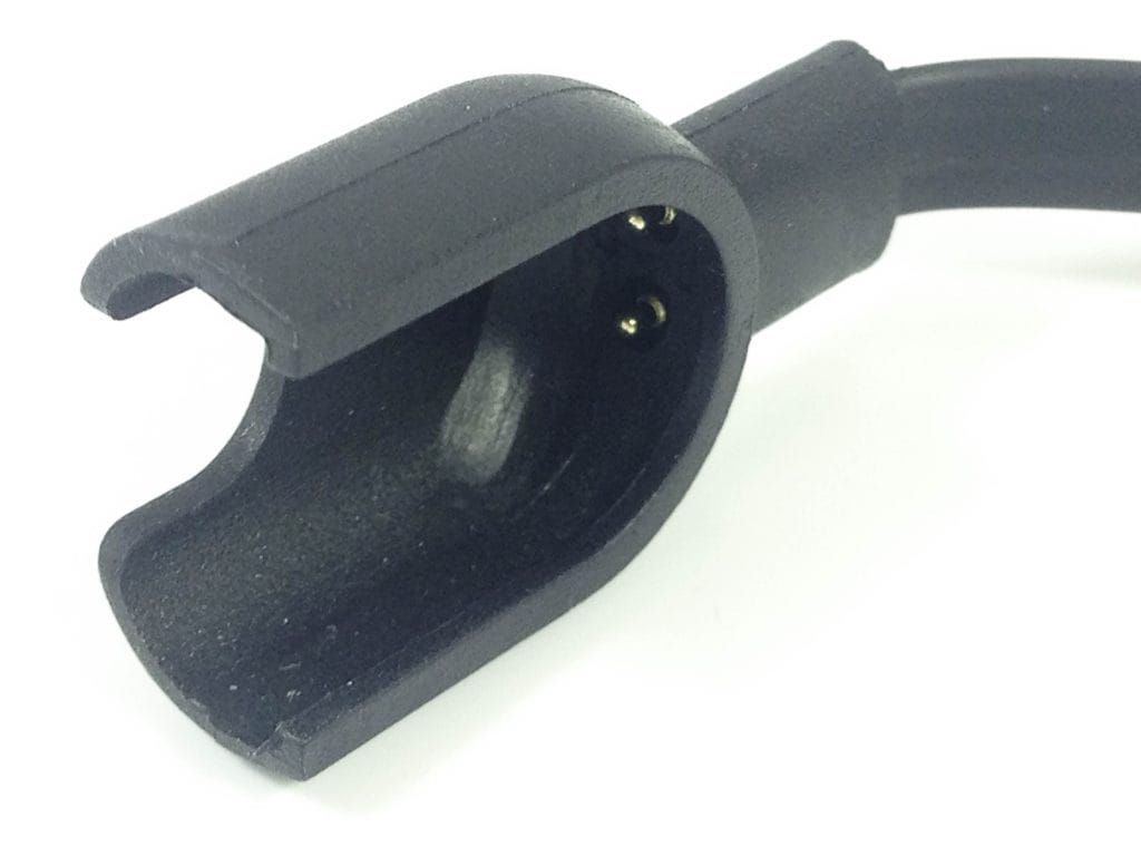 Torus Pro M2S Fitness Tracker Image shows the charging cradle for the Torus Pro M2S Fitness Tracker