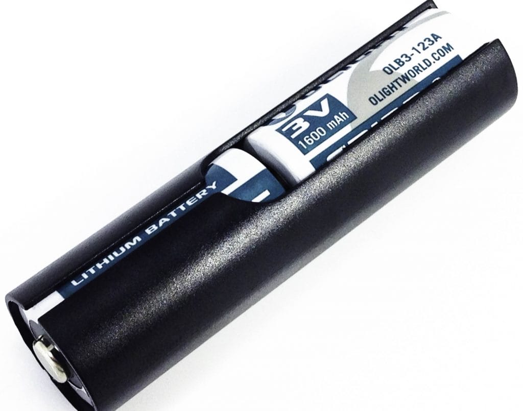 Olight M2T Warrior Flashlight Image shows the batteries inside their plastic housing.