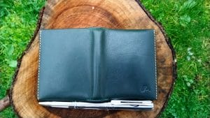 The tan stitching compliments the rainforest green leather very well