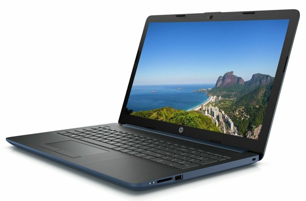 Image shows the laptop in an open position and at an angle with the sea and rock image on the screen.