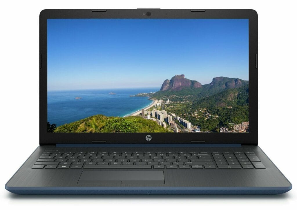 Image shows a HP laptop in an open position. The screen is displaying a sea and rock image.