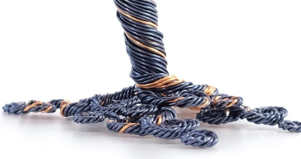 Image shows the twisty style effect of the wire roots of the tree.