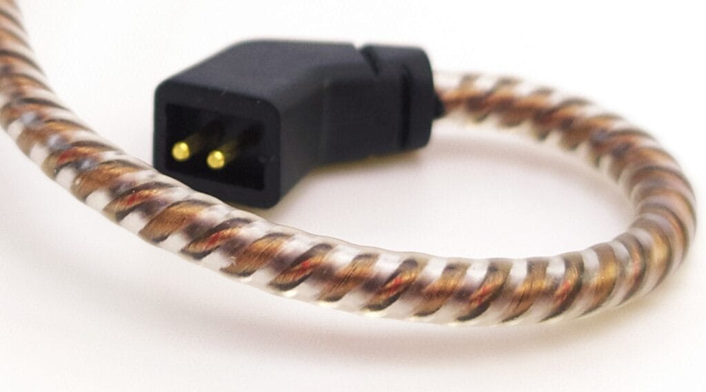 Image shows the male prongs on the cable area.