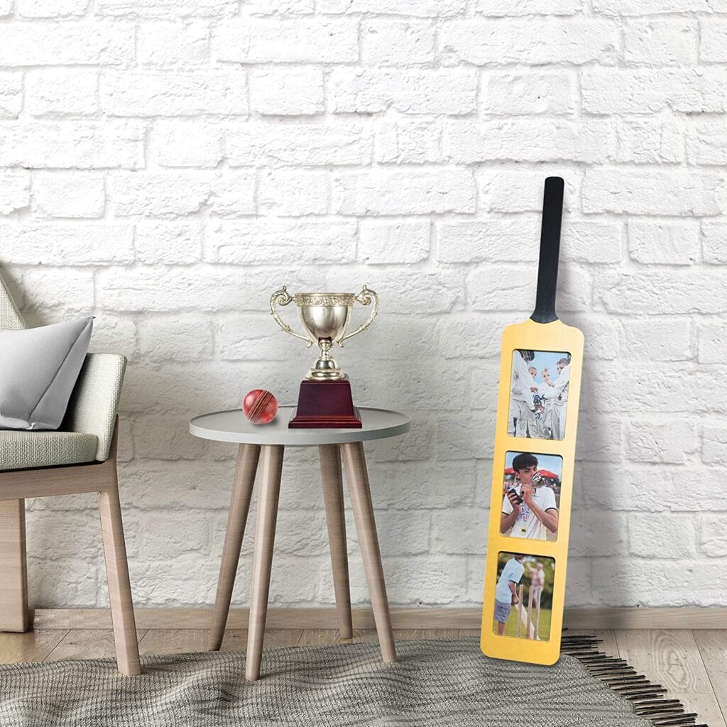 Image shows the Oliphant cricket bat frame leaning against a white brick wall.
