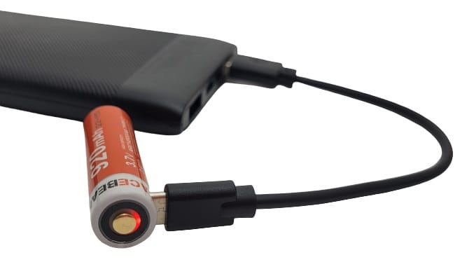 Image shows the battery being charged via a power bank.