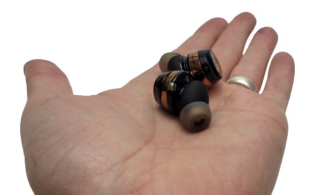 SoundPEATS Opera05 Earbuds Image shows the earbuds in the palm of my left hand.