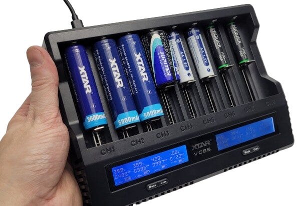 XTAR VC8S Charger Image shows 8 different batteries being charged.