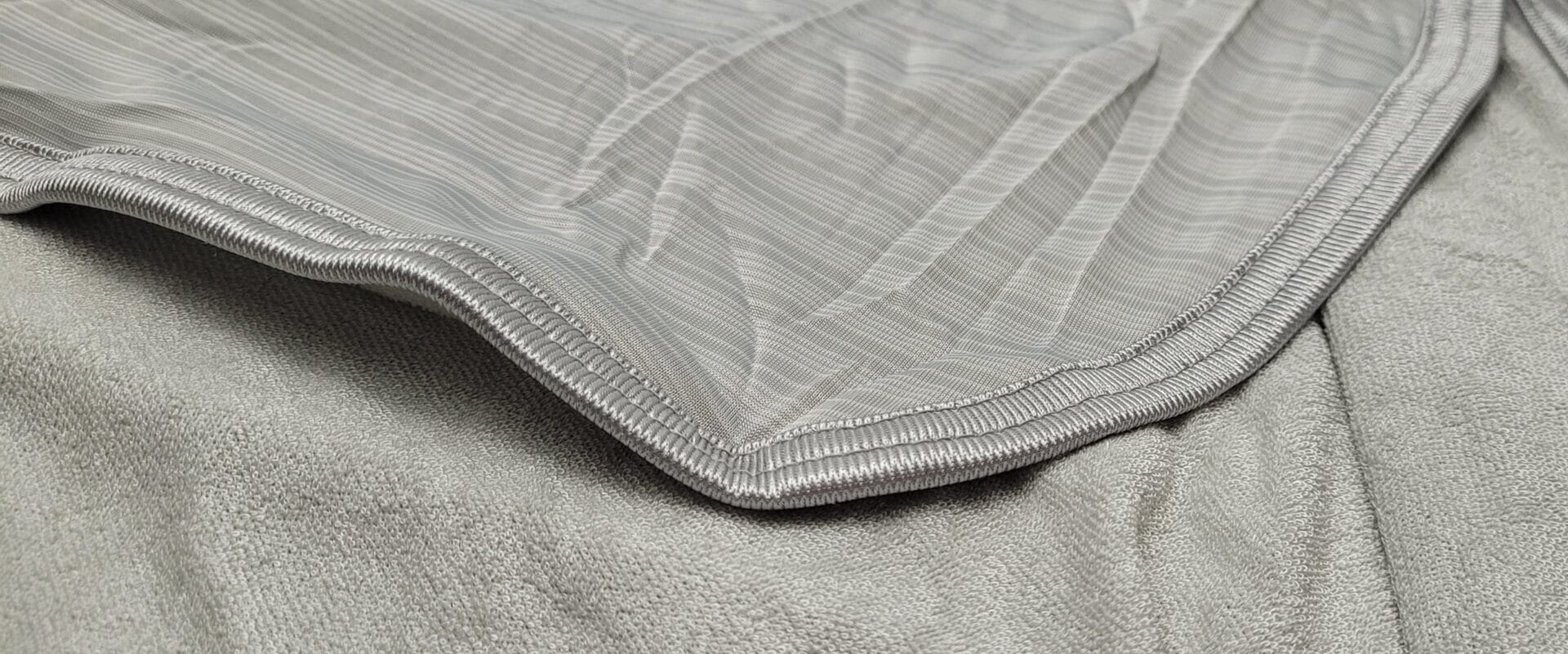 Image shows both sides of the blanket.