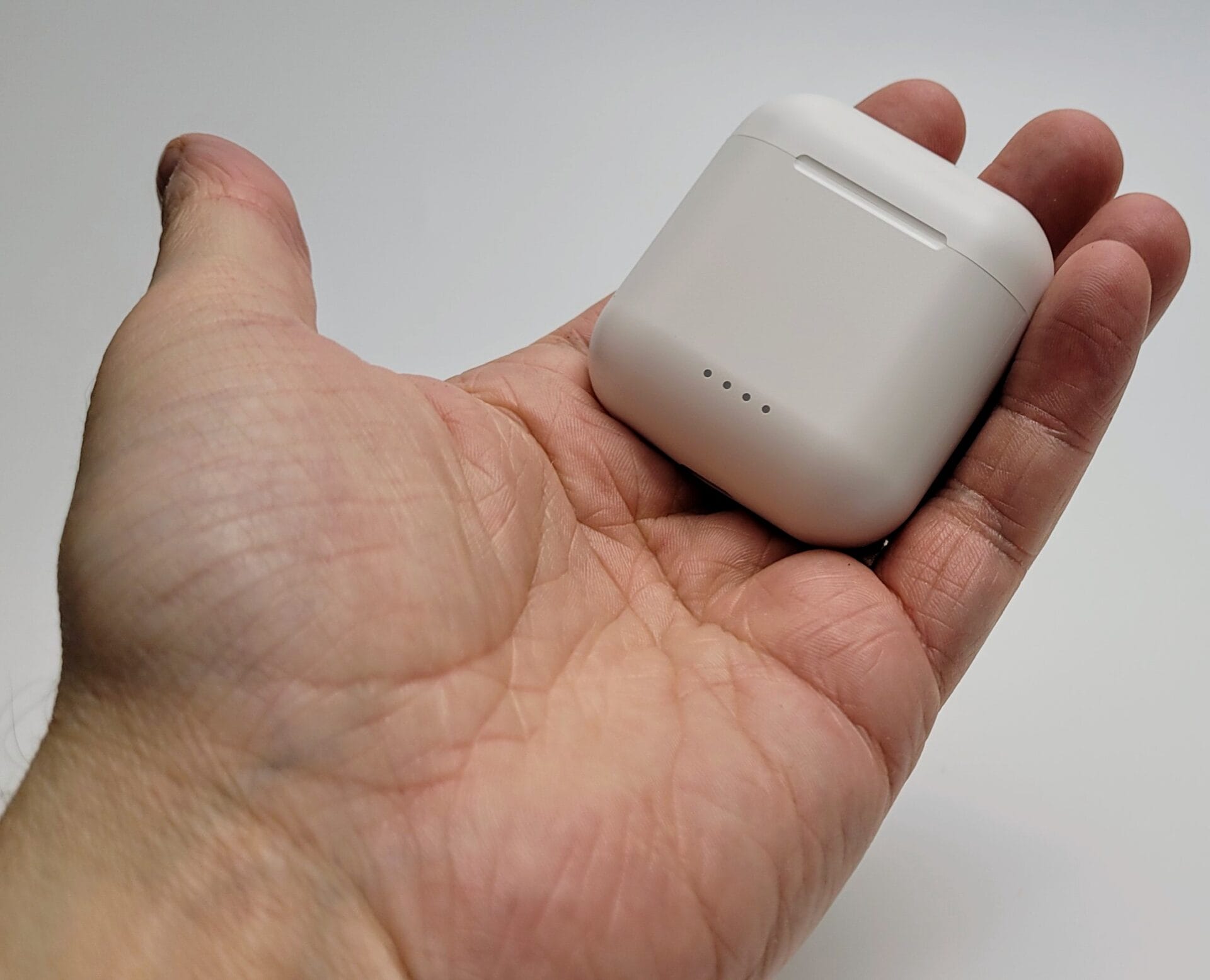 TOZO T6 Wireless Earbuds Image shows the charging case in my left hand (palm)
