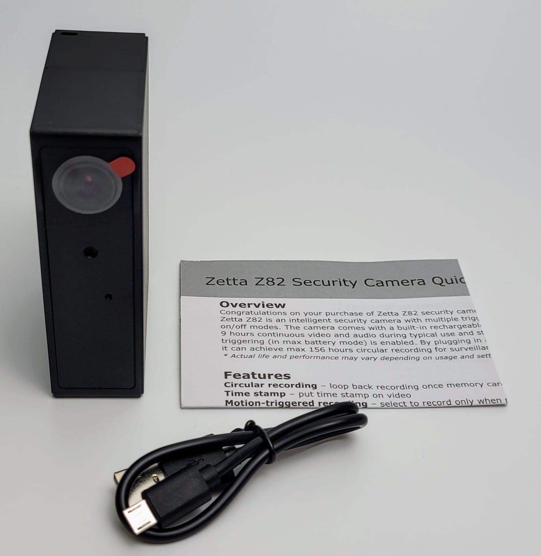 Image shows the included contents for the Zetta Z82 Spy Camera in a laid out position. 