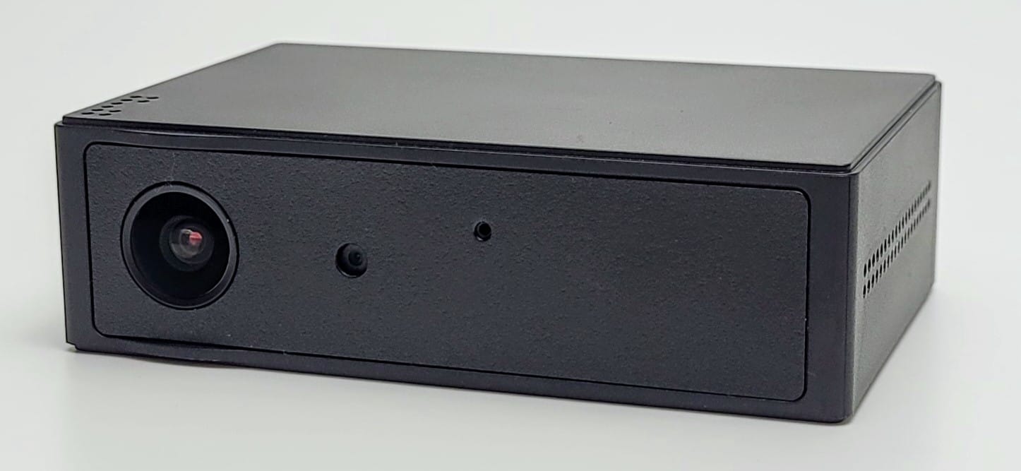 Image shows the Zetta Z82 Spy Camera in a front view, showing both lens and microphone hole.