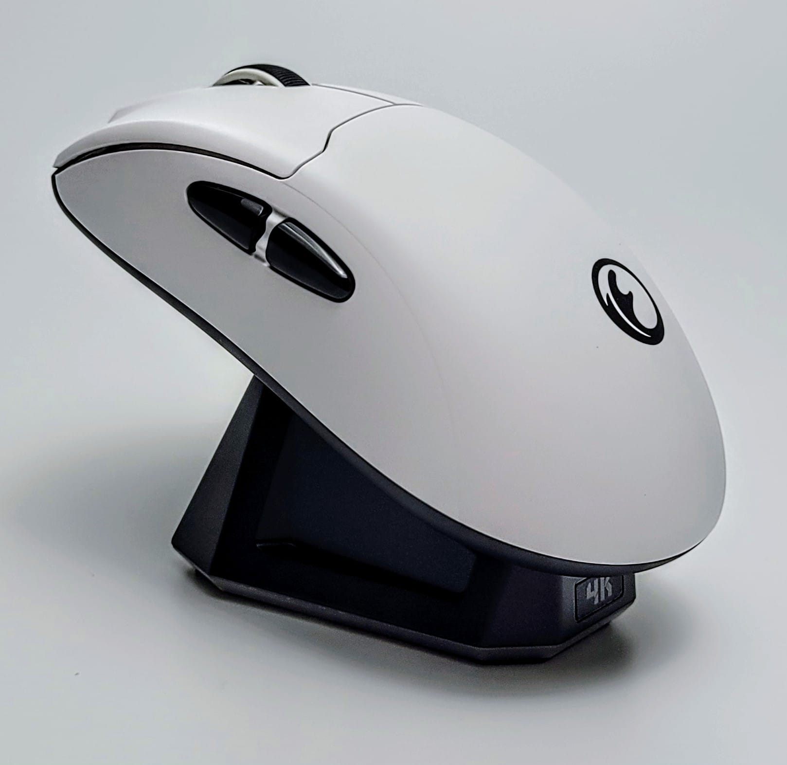 Image shows the mouse on the charging dock.