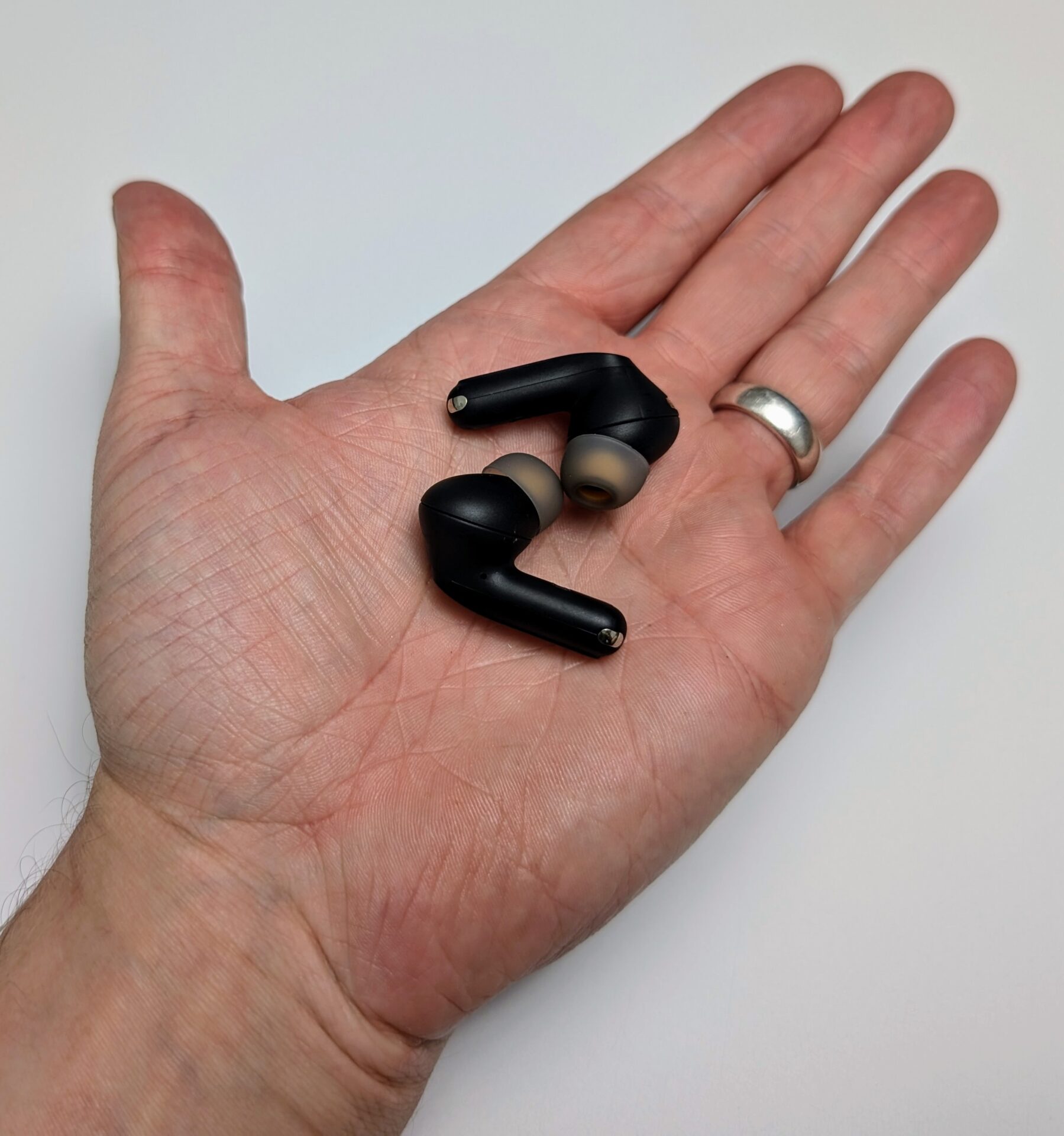 Image shows the SoundPEATS Capsule3 Pro+ earbuds in my left hand.