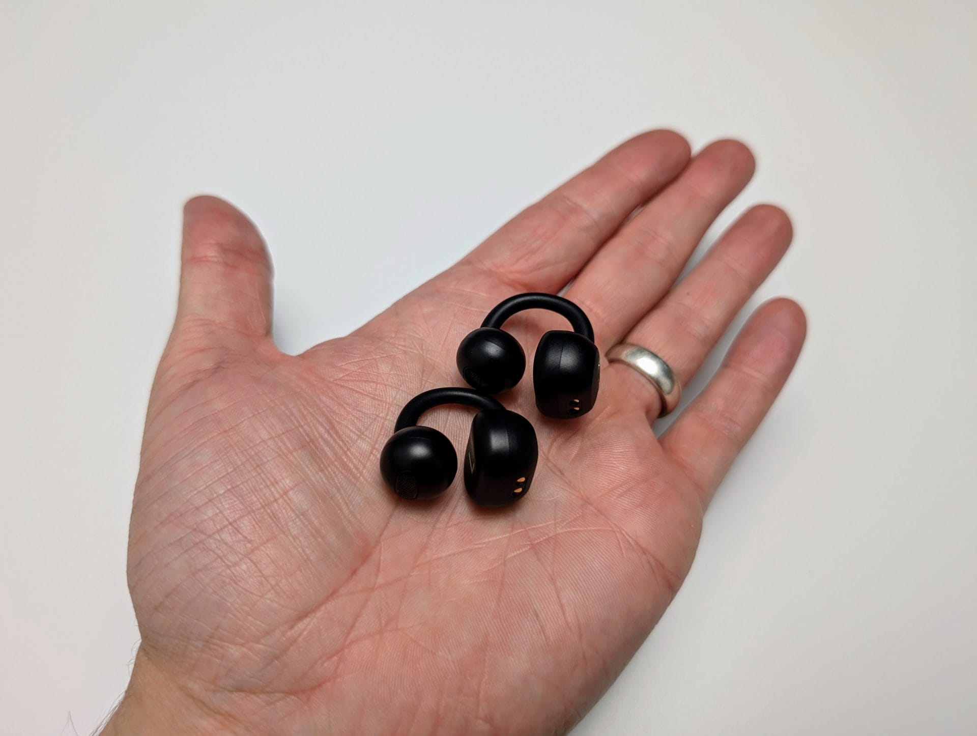 Image shows the TOZO Open EarRing In my left palm.