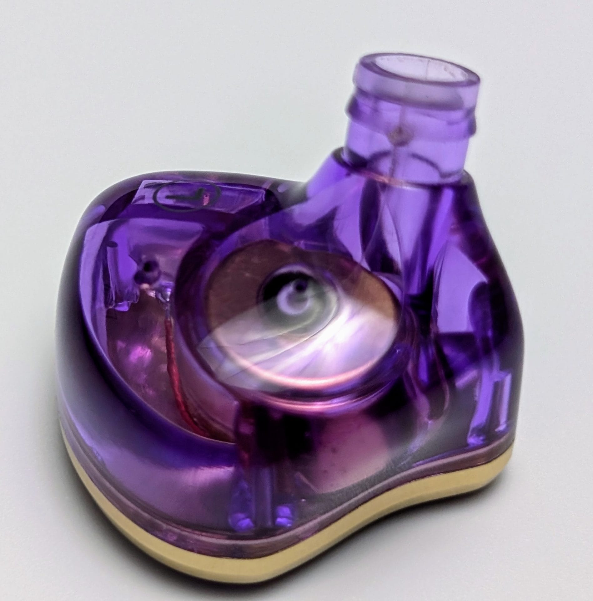 TKZK TK02 IEMs Detailed view of a purple in-ear monitor, highlighting the custom-designed driver and acoustic chamber