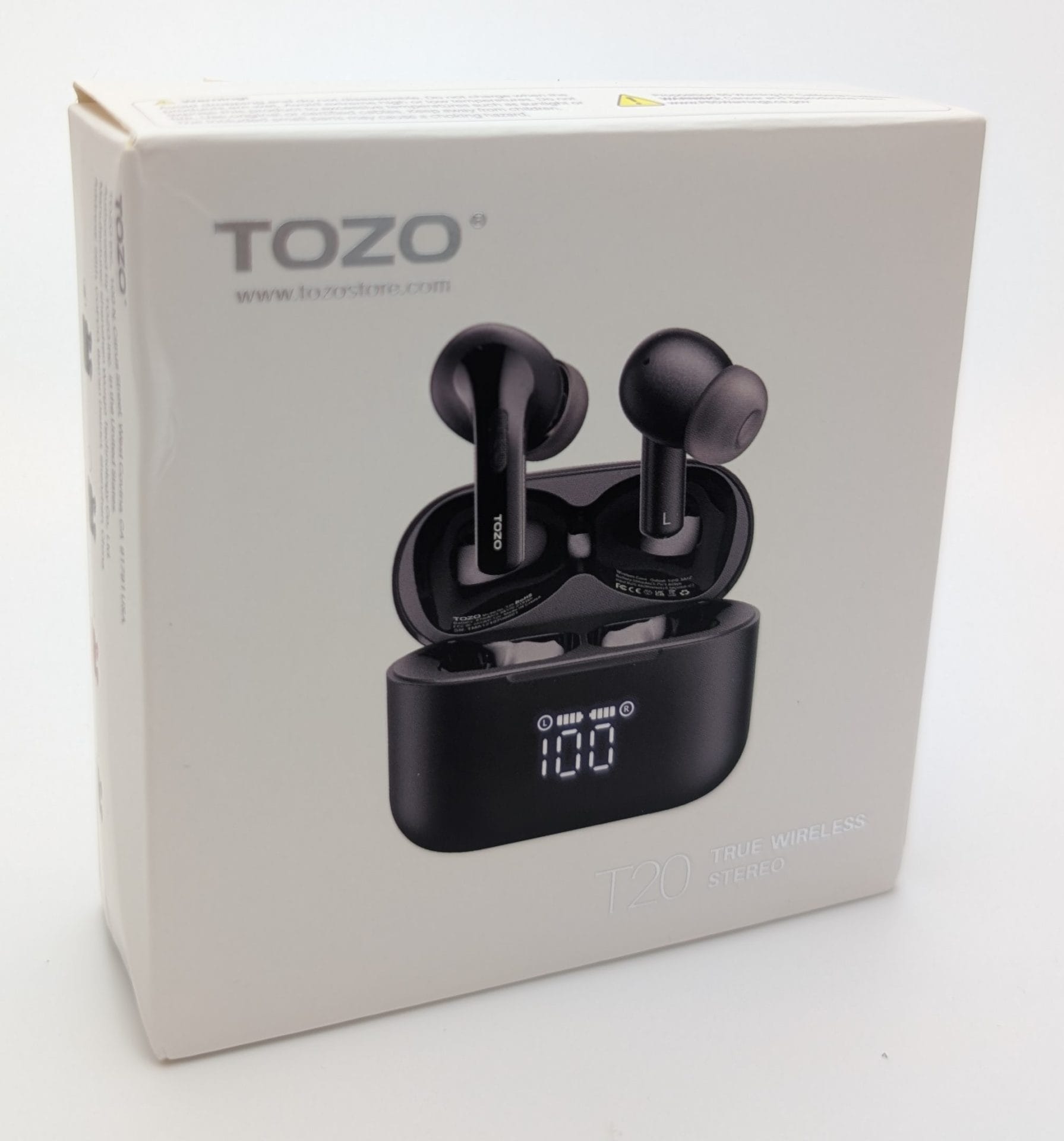 TOZO T20 Wireless Earbuds Image of TOZO T20 True Wireless Stereo Earbuds packaging, featuring a black charging case with a digital display showing "100" and two earbuds placed inside. The box has the TOZO logo and website (www.tozostore.com) (www.tozostore.com) printed on the side, with a sleek, modern design.