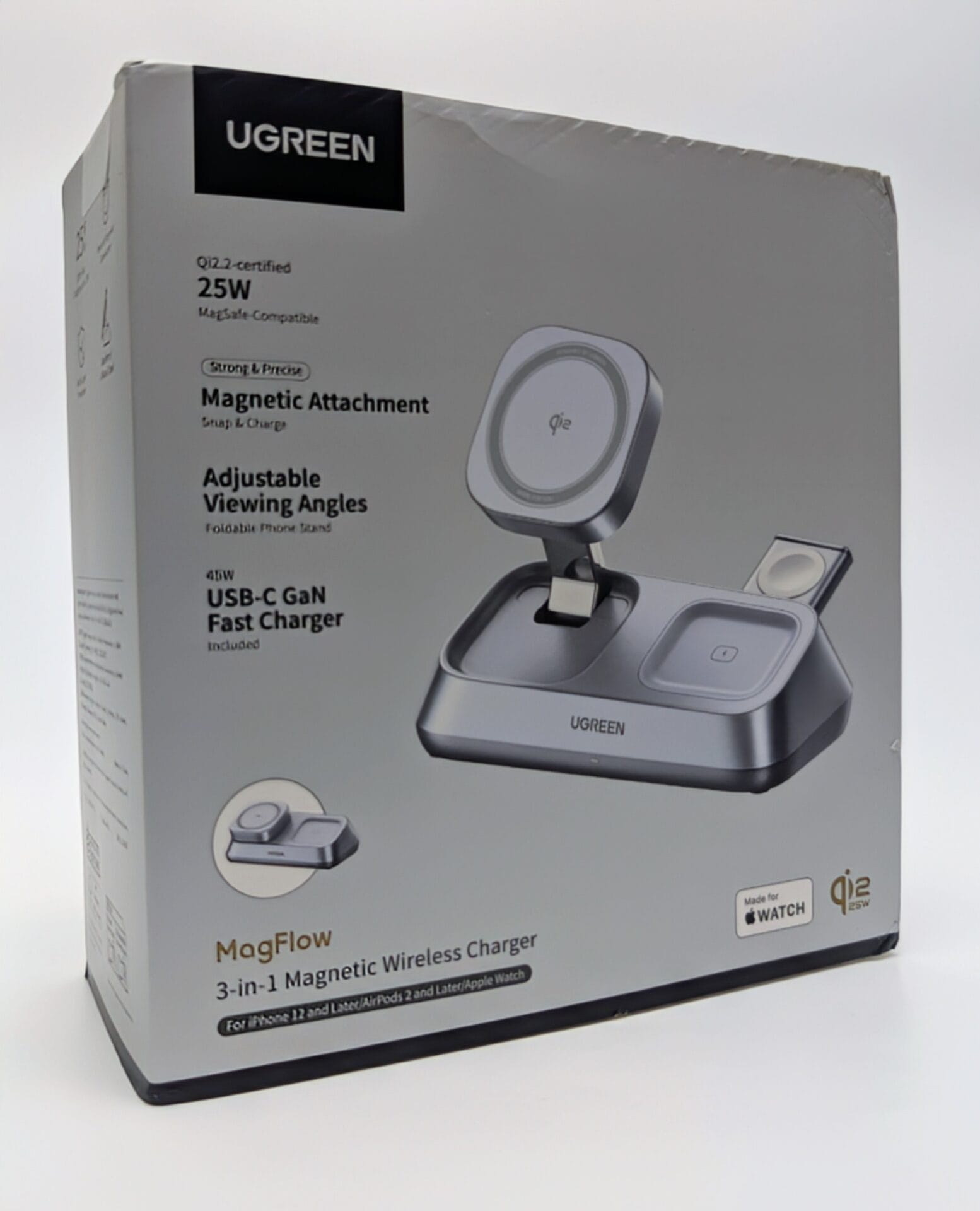 UGREEN MagFlow 3-in-1 Magnetic Wireless Charger retail box. The charger is a grey desktop stand designed to simultaneously charge an iPhone 12 or later (via a foldable, adjustable MagSafe-compatible 25W Qi2 charging pad), AirPods 2 or later, and an Apple Watch. Key features highlighted on the box include Qi2-certified, 25W output, strong magnetic attachment, adjustable viewing angles, and an included 45W USB-C GaN Fast Charger.