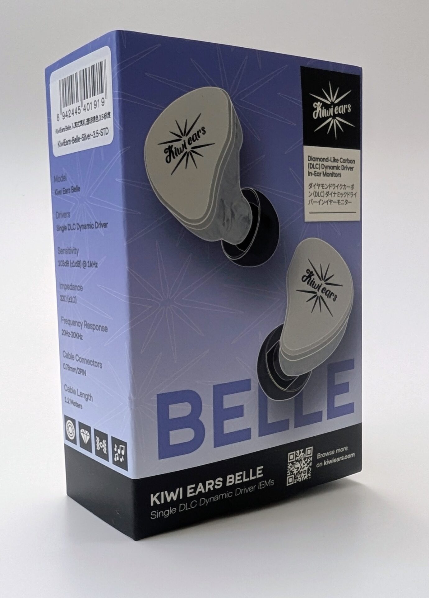 Product box for Kiwi Ears Belle in-ear monitors (IEMs). The blue and black packaging features images of the silver-colored earpieces with the Kiwi Ears starburst logo. Text on the box includes 'KIWI EARS BELLE', 'Single DLC Dynamic Driver IEMs', 'Diamond-Like Carbon (DLC) Dynamic Driver', frequency response 20Hz-20kHz, and a QR code linking to kiwiears.com.